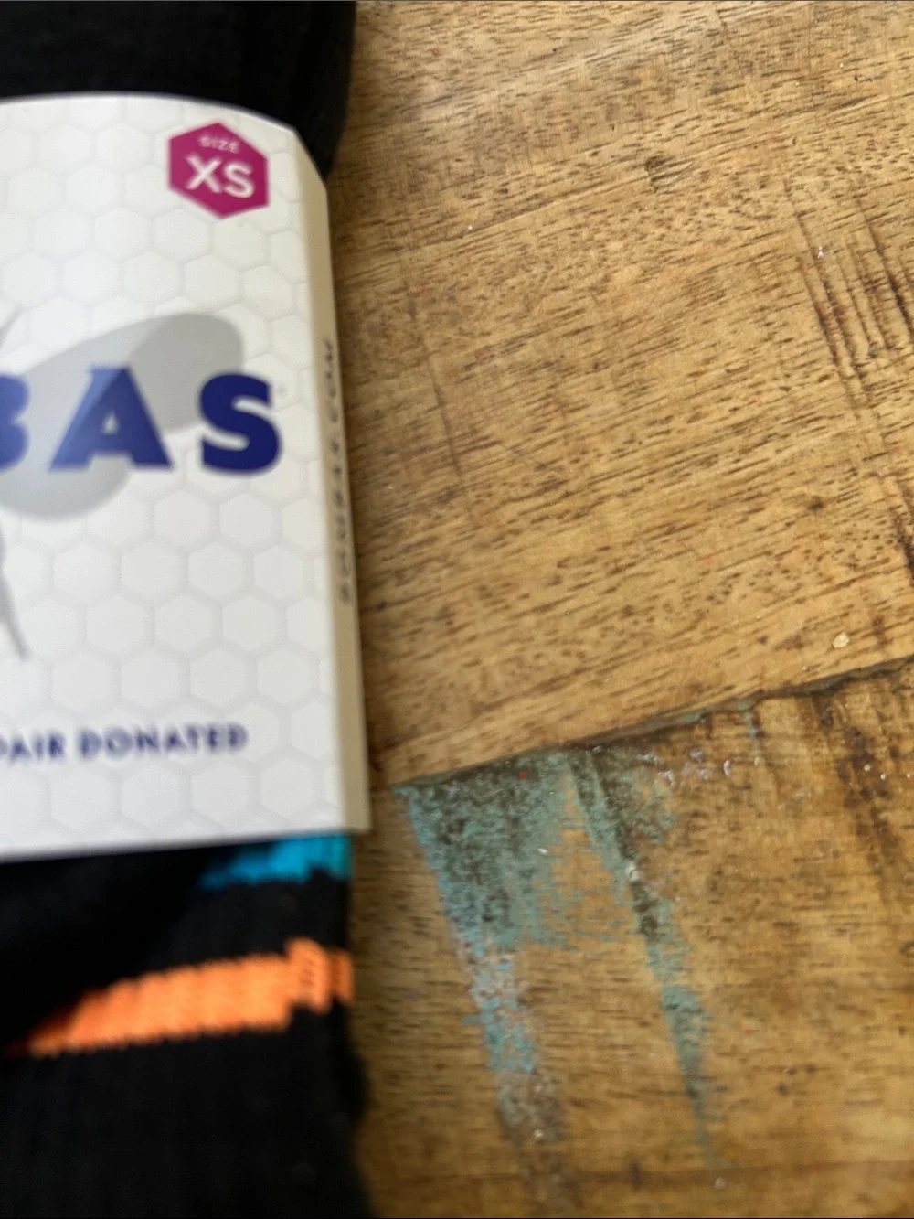 Bombas Black Crew Socks with Orange, Blue, and Yellow Accents for Children